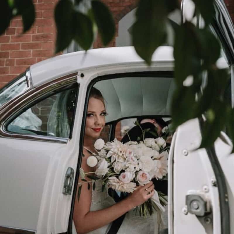 bridal bouquet - woman getting out of car